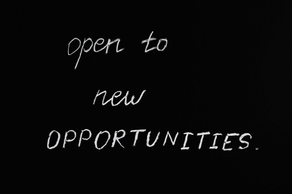 pexels-photo-5598293-5598293 Blackboard with motivational quote 'Open to New Opportunities' in chalk writing.